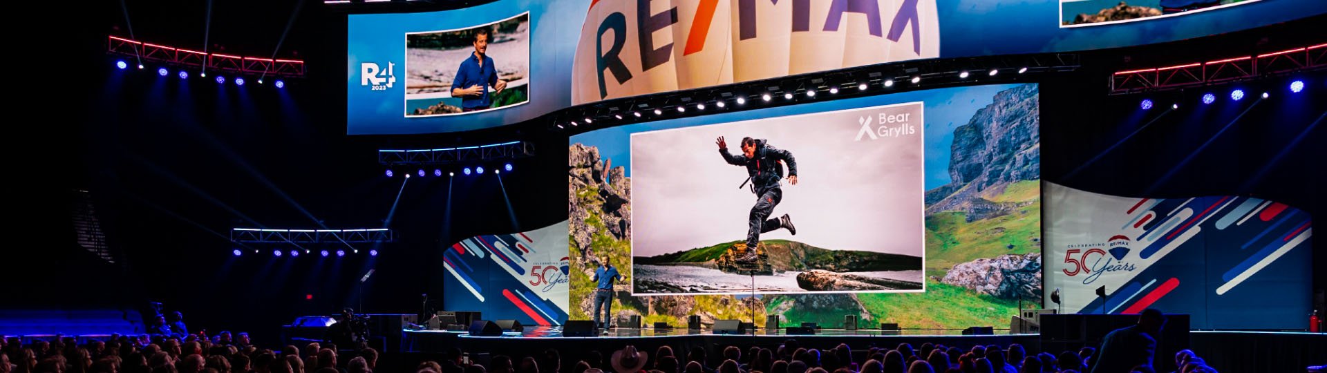 REMAX R4 Conference in Las Vegas, Nevada in the MGM Grand Ballroom. LED Wall stage set design with speaker talking about mountain climbing.